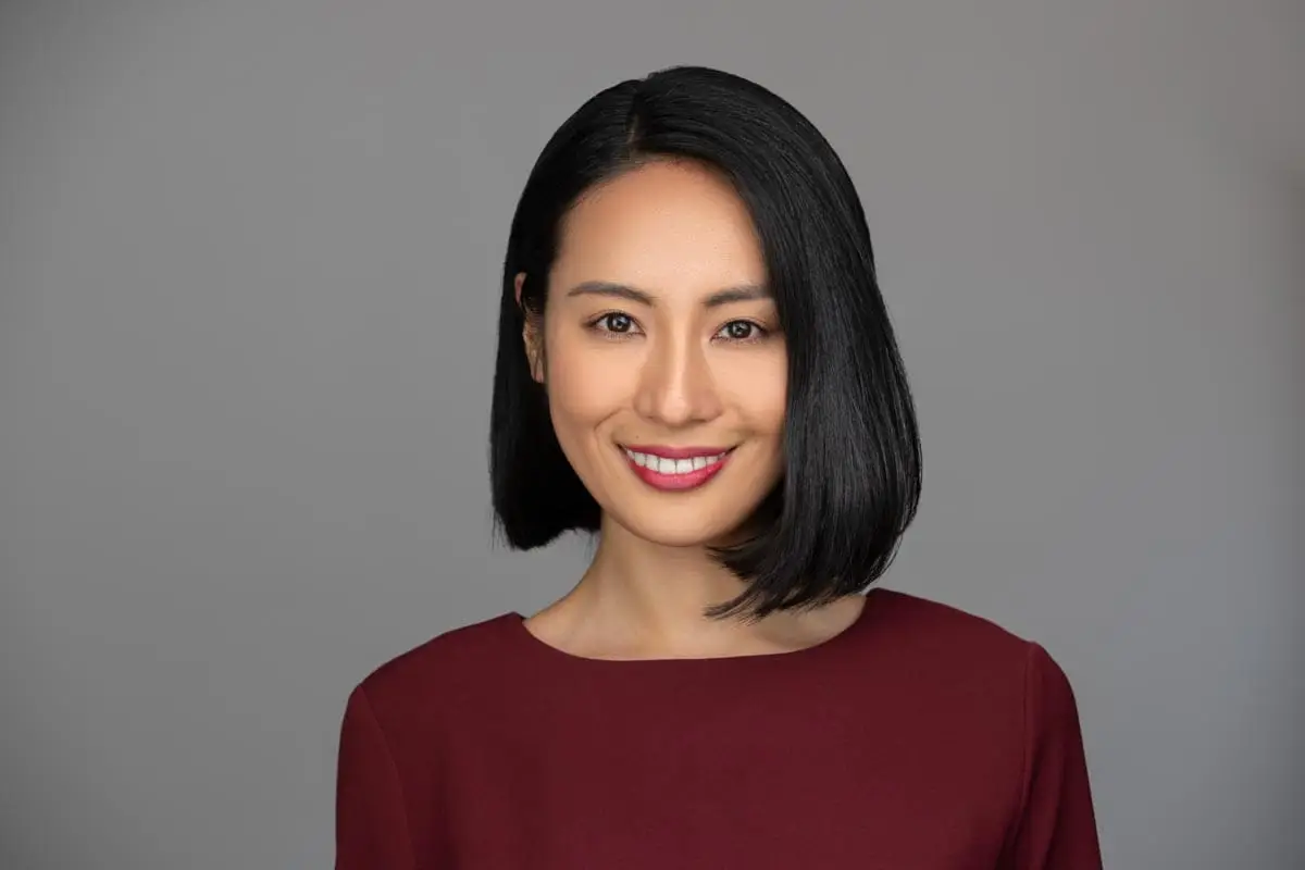 Corporate headshot Sydney, woman on grey background